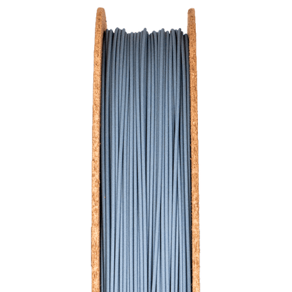 A spool of silicon carbide filamet filament, used for 3D printing.