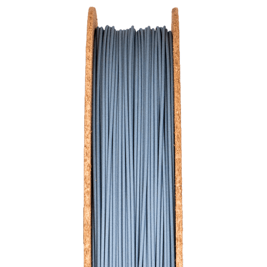 A spool of silicon carbide filamet filament, used for 3D printing.