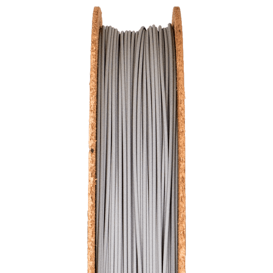 A spool of Stainless Steel 316L Filamet filament, designed for use in 3D printing.