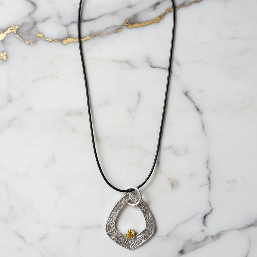 Artisan-Made Silver Necklace with Botanical Texture