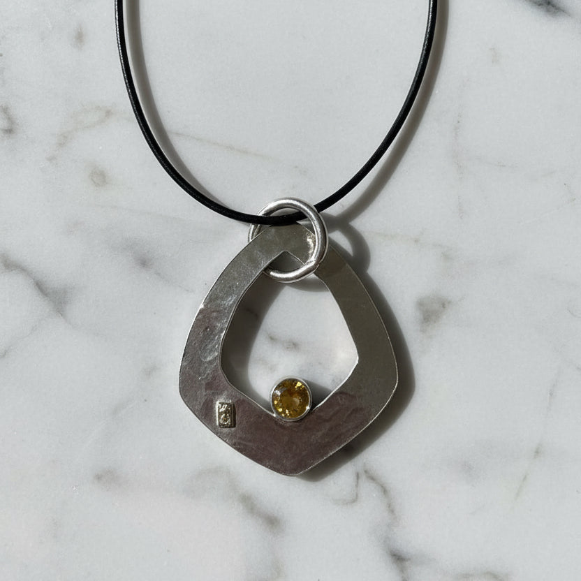 Artisan-Made Silver Necklace with Botanical Texture