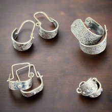 Load image into Gallery viewer, Silver hoop earrings on a wooden surface. Silver Metal Clay Class with Carrie Story. 