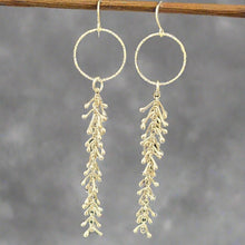 Load image into Gallery viewer, Dangling silver earrings with leaf-like dangling elements on a gray background. Class Online and In Person
